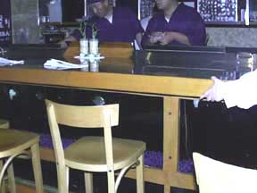 (at the bar)